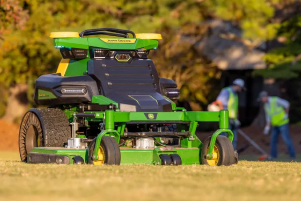 The John Deere robot lawnmower autonomously navigating a lawn with 360-degree stereo cameras.