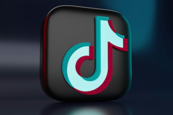 TikTok app logo with U.S. flag in background symbolizing the legal battle over the TikTok ban in the U.S.