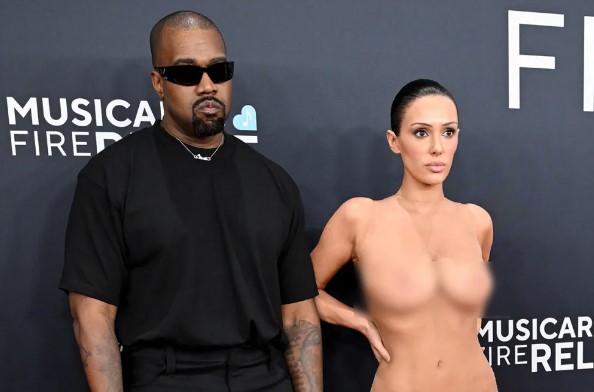 Bianca Censori revealing her naked look in a see-through slip on the Grammy 2025 red carpet with Kanye West by her side.